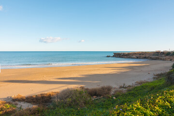 Empty beach during the Coronavirus crisis (Covid 19 pandemic). Seascape on a sunny day.