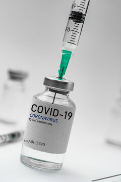Covid19 Vaccine syringes and medicine bottles in white environment