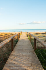 Fototapeta na wymiar Beautiful wooden boardwalk leading to the beach.