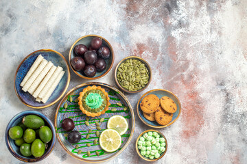 top view little creamy cake with fruits on light background candy photo biscuits sweet