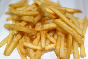 Close-up of French Fries on a table in a fast-food restaurant.