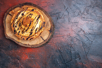 top view delicious pancakes with icing on a dark background cake sweet dough