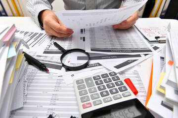 business concept - businessman working with reports in office, table and workspace close view,...