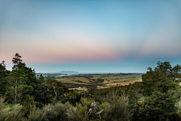 pastel color sunset in the meadows of Mangawhai