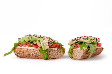 Sandwitch with lettuce, avocado and tomato, isolated. White background.