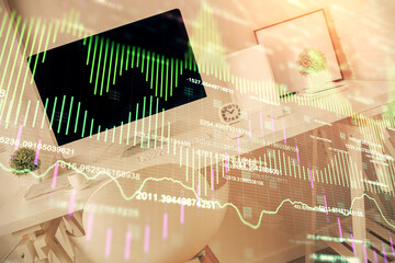 Double exposure of financial graph drawing and office interior background. Concept of stock market.