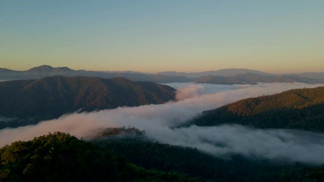 Aerial view forest in morning fog mist, breathing mountains, Sunshine on The Morning Mist. (Huay Hub Kab) Chaing mai Thailand.