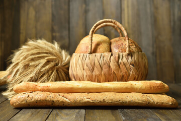 Assortment breads with long French baguette and basket with round bread