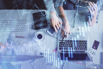 Double exposure of man and woman working together and financial graph hologram drawing. market analysis concept. Computer background. Top View.