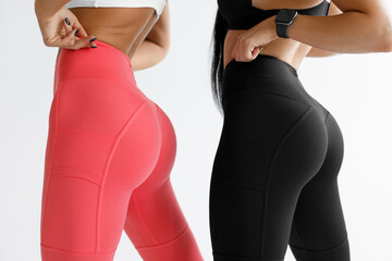 Fitness models in leggings with beautiful buttocks. Sporty booty