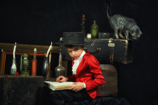 Portrait of a boy in the image of a vampire in the studio