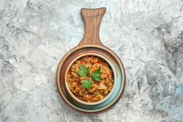 top view roasted eggplant salad in bowl on grey background free space