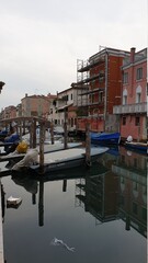 Fototapeta na wymiar Chioggia, Venice, Italy: waterway in the old town with fishing boats