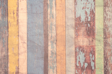Vertically arranged multi-colored weathered boards as a background, texture, pattern.