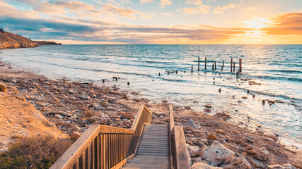 Port Willunga Beach view with jetty ruins at sunset,  South Australia