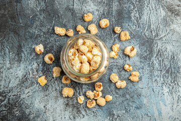 top view sweet popcorn inside glass can on light background snack movie sugar