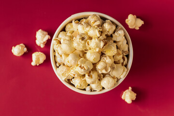 popcorn blast top view cinema box with corn bucket on red isolated