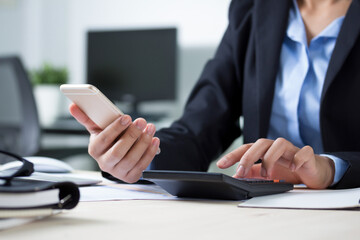 business accounting with saving money with hand holding lightbulb concept financial background