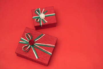Red gift box for christmas theme on the red background.