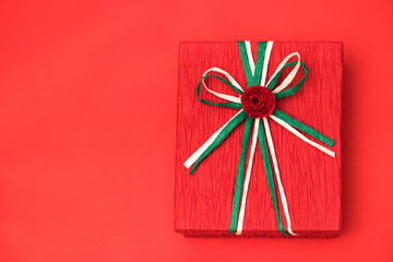 Red gift box for christmas theme on the red background.