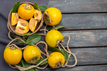top view fresh sweet persimmons on the wooden rustic desk tree taste ripe fruit