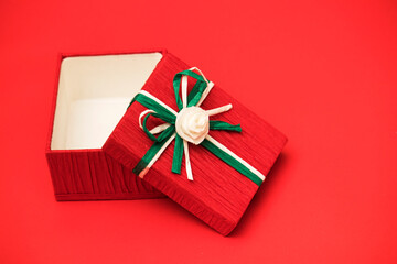 Red gift box for christmas theme on the red background.