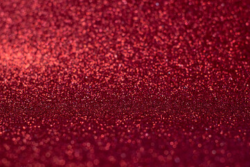 Texture of red sparkles, close up, bright colorful texture, close up
