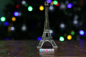 Plastic cubes with the word PARIS with the eiffel tower in the background