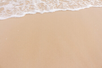 Naklejka na ściany i meble Soft beautiful wave on sandy beach. Background.