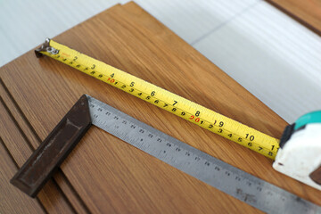 Wood parquet pieces with working tools, board for flooring.