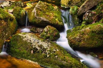 Autumn long exposure of creek Black (Big) Stolpich waterfalls in Jizera Mountain. Water falls into...