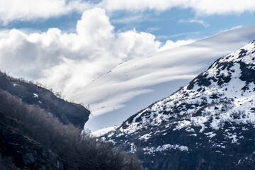 High snowy mountains and clouds in the sky