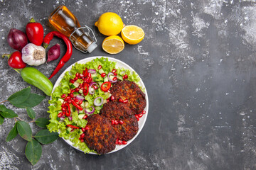 top view delicious meat cutlets with fresh salad on grey background meal photo food dish