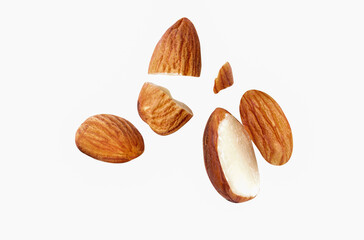 almond nut is Blast to pieces close-up on white isolated