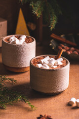 Obraz na płótnie Canvas Hot cocoa with marshmallow in ceramic cups