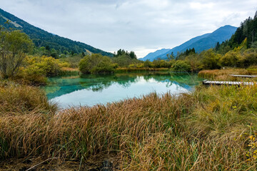 A beautiful small mountain lake in Slovenia in autumn.