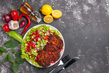 top view delicious meat cutlets with fresh salad on grey background meal dish photo food