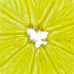 Close-up of a yellow lemon slice isolated on a white background.