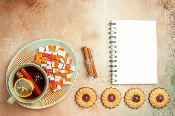 top view little cookies with cup of tea on brown background sweet biscuit cake dessert
