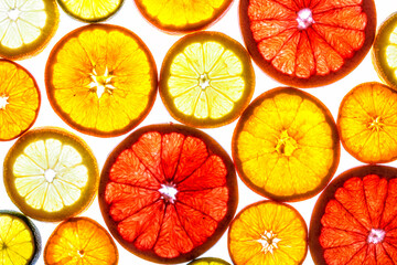 Collage of various fruit slices isolated on a white background.