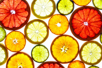 Collage of various fruit slices isolated on a white background.