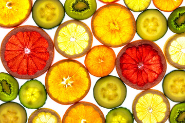 Collage of various fruit slices isolated on a white background.