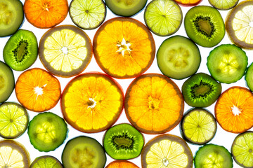 Collage of various fruit slices isolated on a white background.