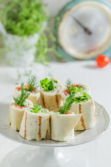 Tasty tortilla with salmon, creamy cheese and vegetables