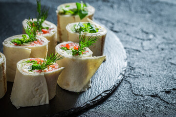 Tortilla rolls with vegetables, cheese and herbs