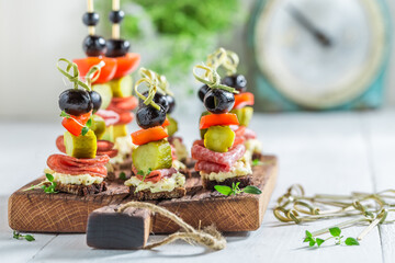 Homemade finger food made of meat, olive and vegetables