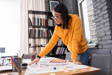 Woman standing near desk with instruments