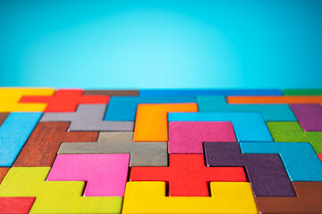 Geometric shapes on a wooden background. The concept of logical thinking. 