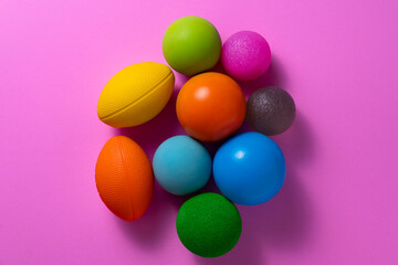close up stress balls on pink table background
