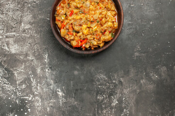 top view roasted eggplant salad in bowl on dark background free space
